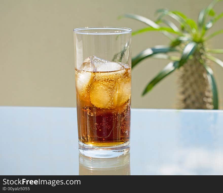 Glass cola an ice on  table. Glass cola an ice on  table