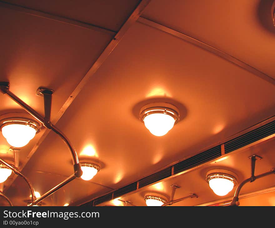 Ceiling, illumination and hand-rail of the transit vehicle of the underground