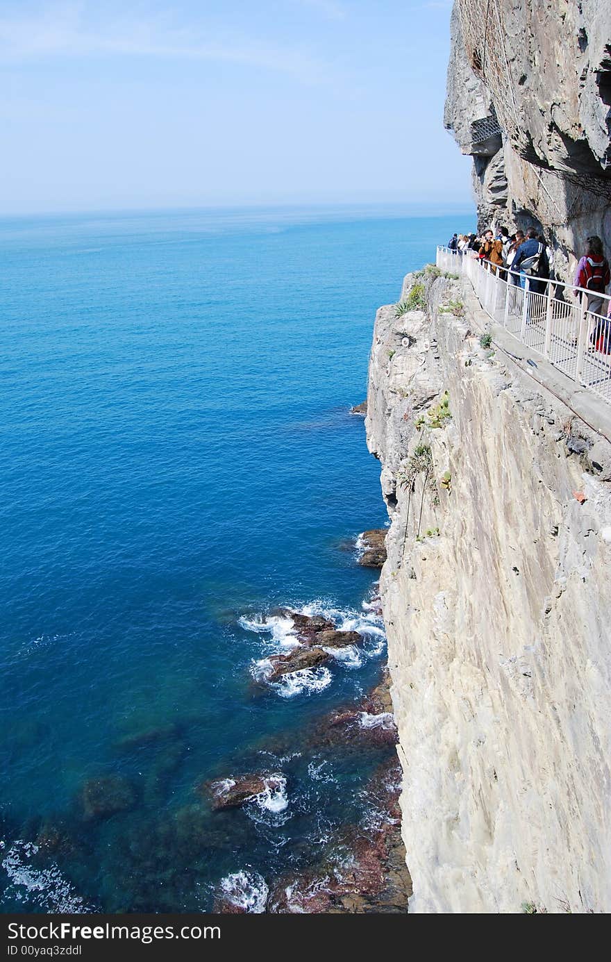 Blue sea and a path in the rock in Cinque Terre, Liguria in Italy.