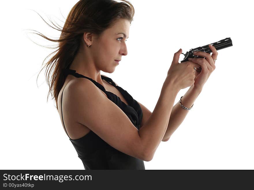 Young woman with revolver isolated on white background