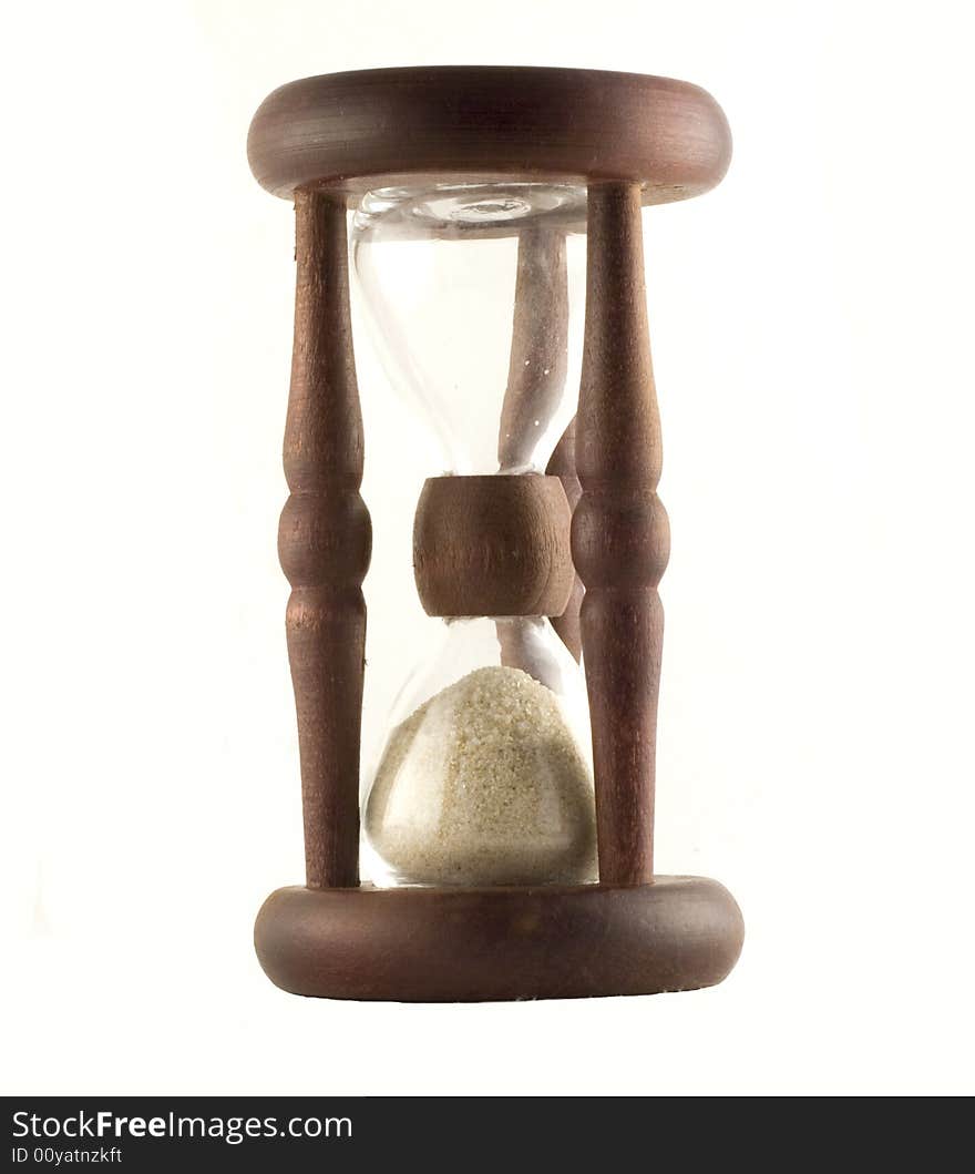 Ancient wooden sand-glass on white background