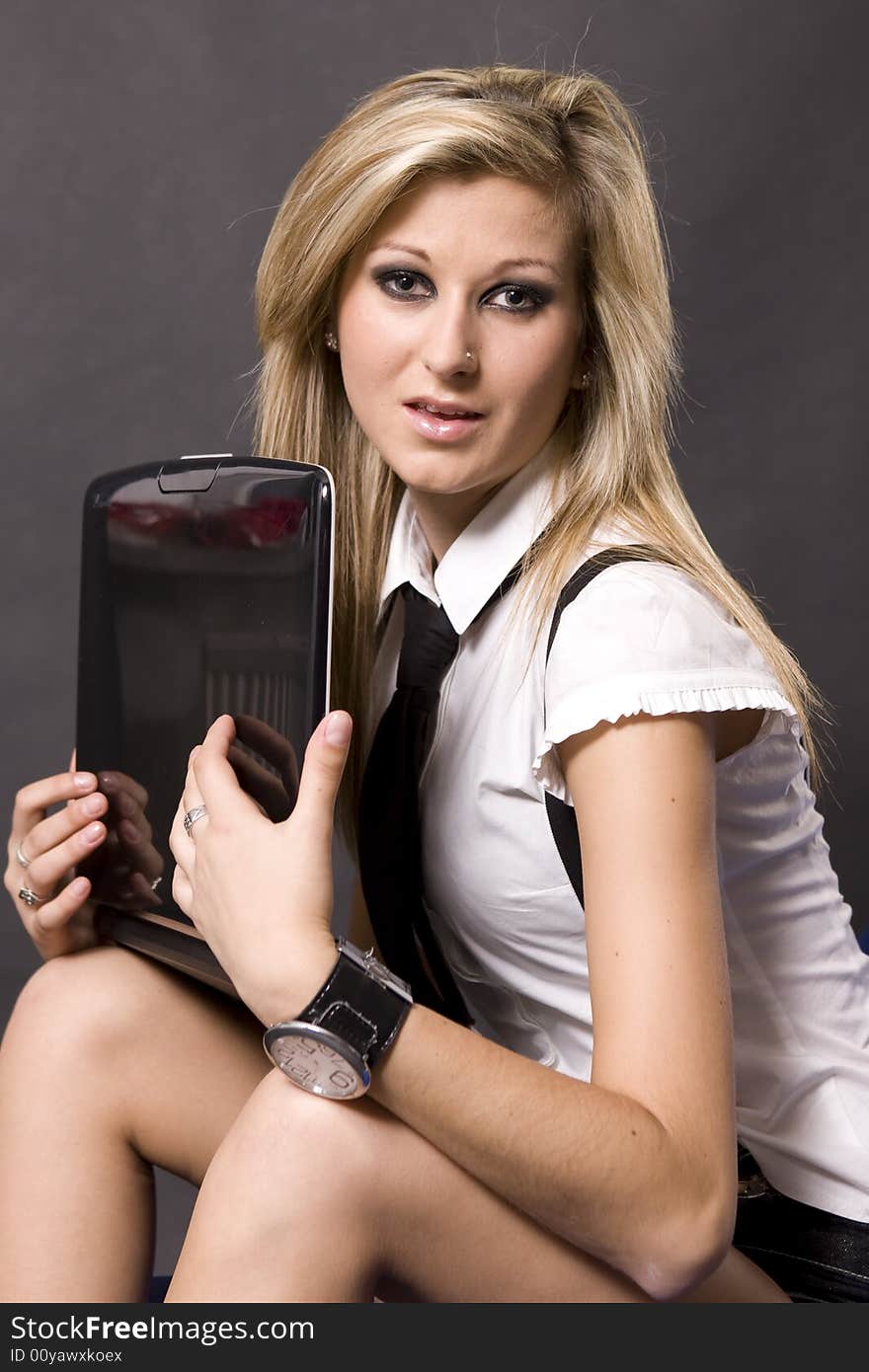 Photo of a woman working in the front of a computer. Photo of a woman working in the front of a computer