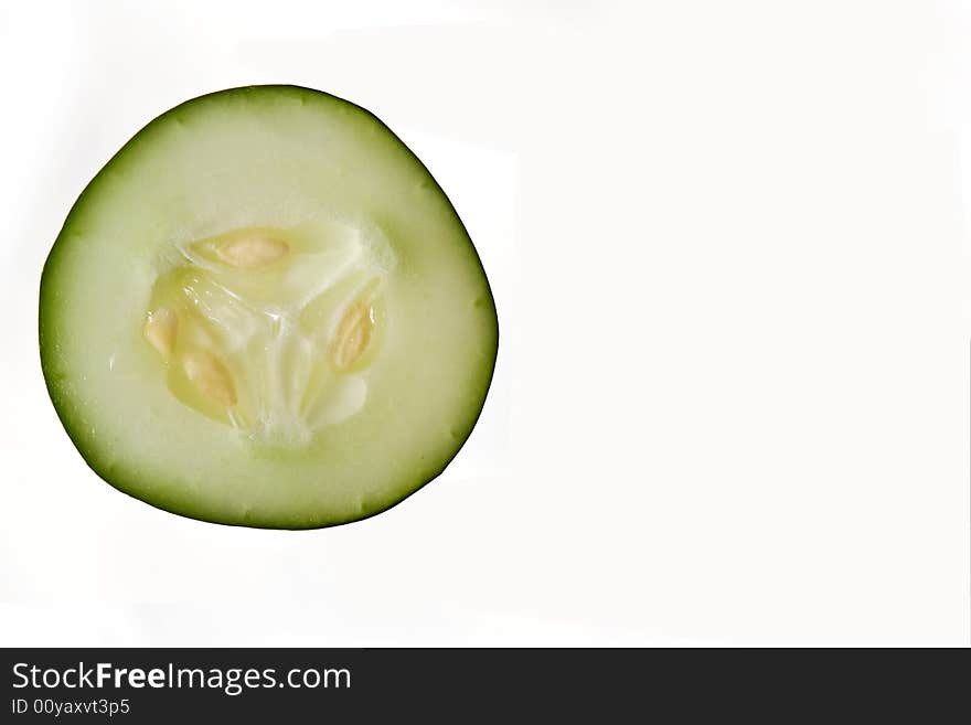 A wedge of cucumber used in a spa for avoiding aging and creating youth, isolated on white. A wedge of cucumber used in a spa for avoiding aging and creating youth, isolated on white