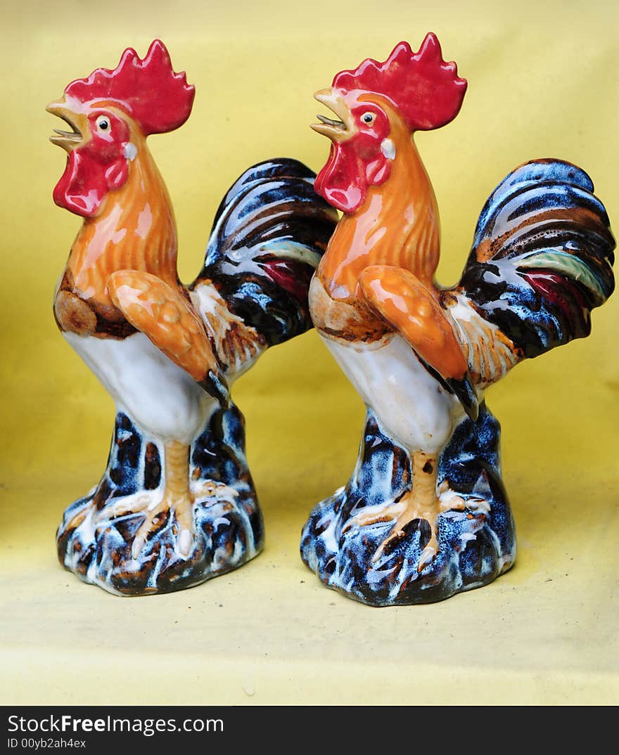 Two ceramic roosters