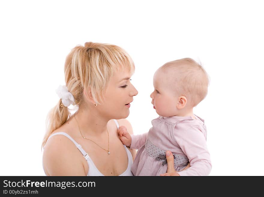 Mother hold baby girl and look at her eyes. Image isolated on white background. Mother hold baby girl and look at her eyes. Image isolated on white background