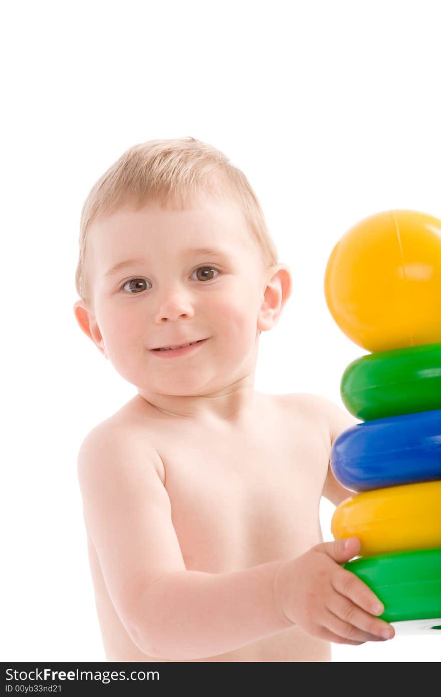 Baby hold tower from colorful discs. Image isolated on white background