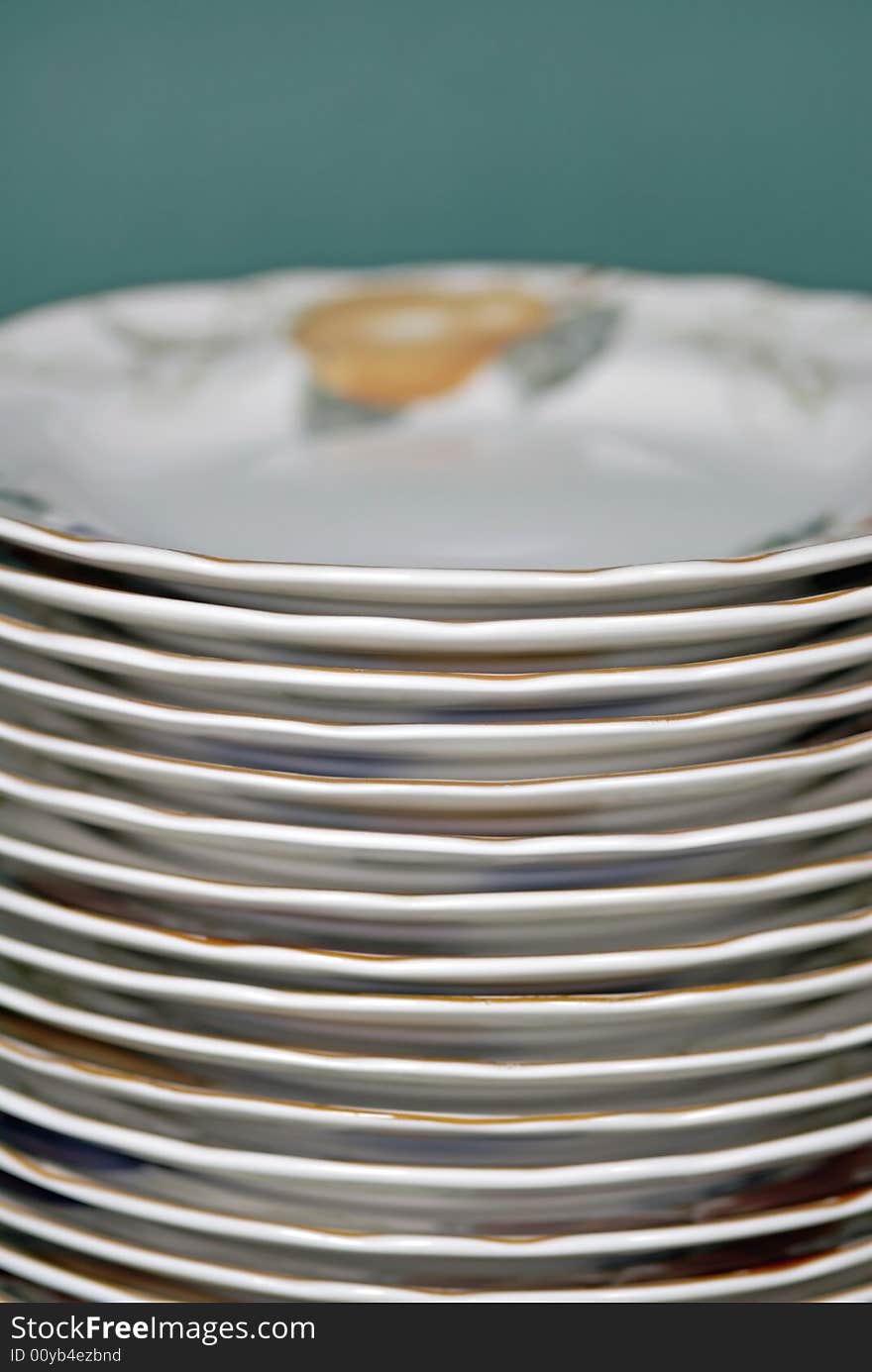 Stack of white dinner plates on white background. Stack of white dinner plates on white background.