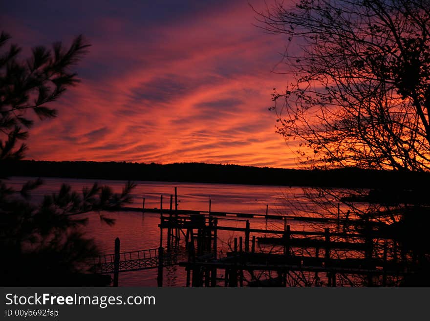 A sunset over the Bellamy River looking out onto some docks. A sunset over the Bellamy River looking out onto some docks.