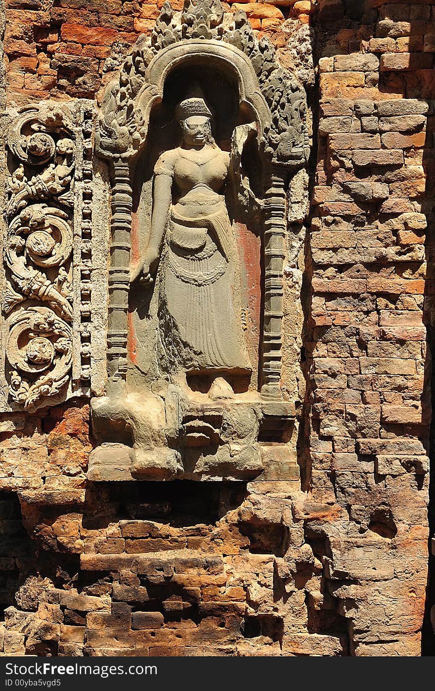 In Cambodia in the ancient city of Roulos the Hindu temple of Preah Ko or� The sacred bull� was built in the 9th century by the king Indravarman. View of a carved wall with apsara. In Cambodia in the ancient city of Roulos the Hindu temple of Preah Ko or� The sacred bull� was built in the 9th century by the king Indravarman. View of a carved wall with apsara