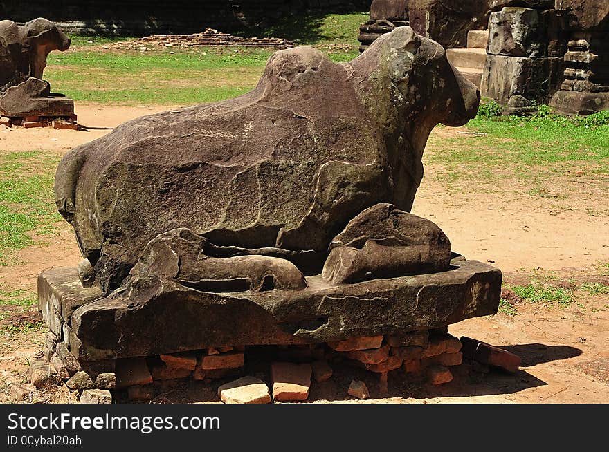 In Cambodia in the ancient city of Roulos the Hindu temple of Preah Ko or� The sacred bull� was built in the 9th century by the king Indravarman. View of the statue of the bull Nandi. In Cambodia in the ancient city of Roulos the Hindu temple of Preah Ko or� The sacred bull� was built in the 9th century by the king Indravarman. View of the statue of the bull Nandi