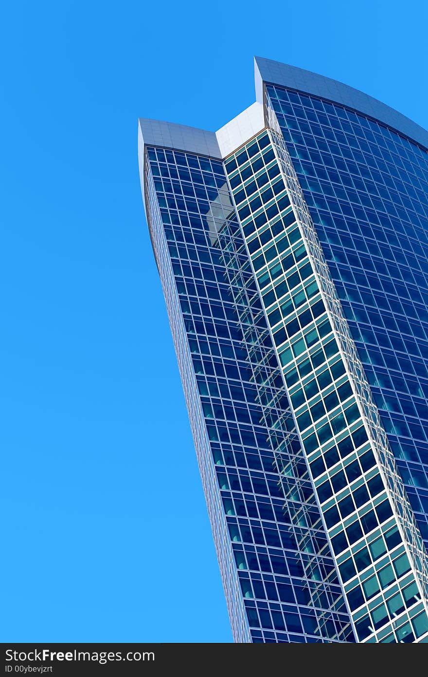 Skyscraper on a background of the blue sky. Skyscraper on a background of the blue sky