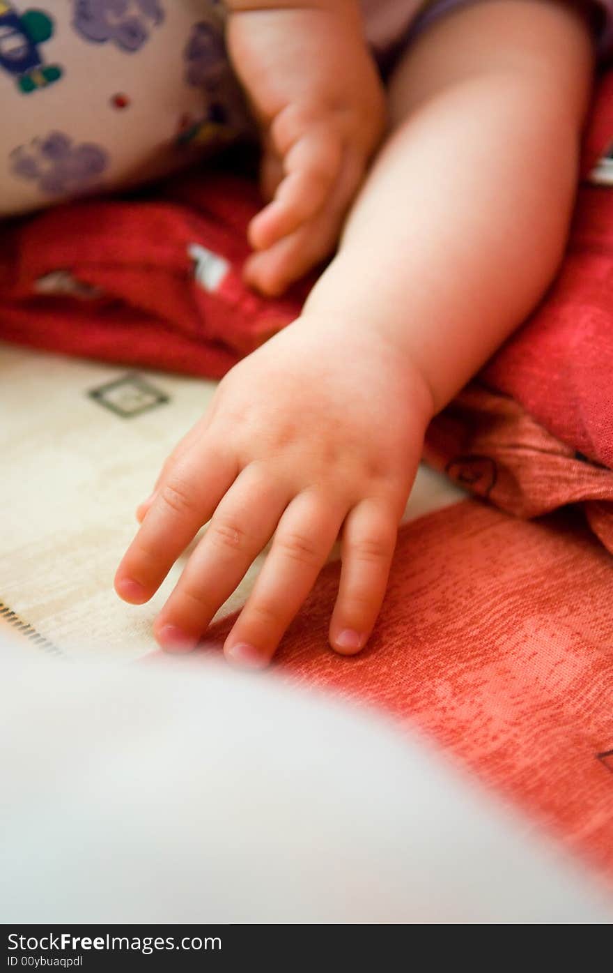 Newborn kid s hand