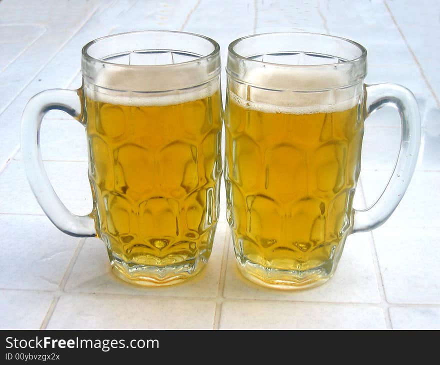 A couple of beer glasses. A couple of beer glasses