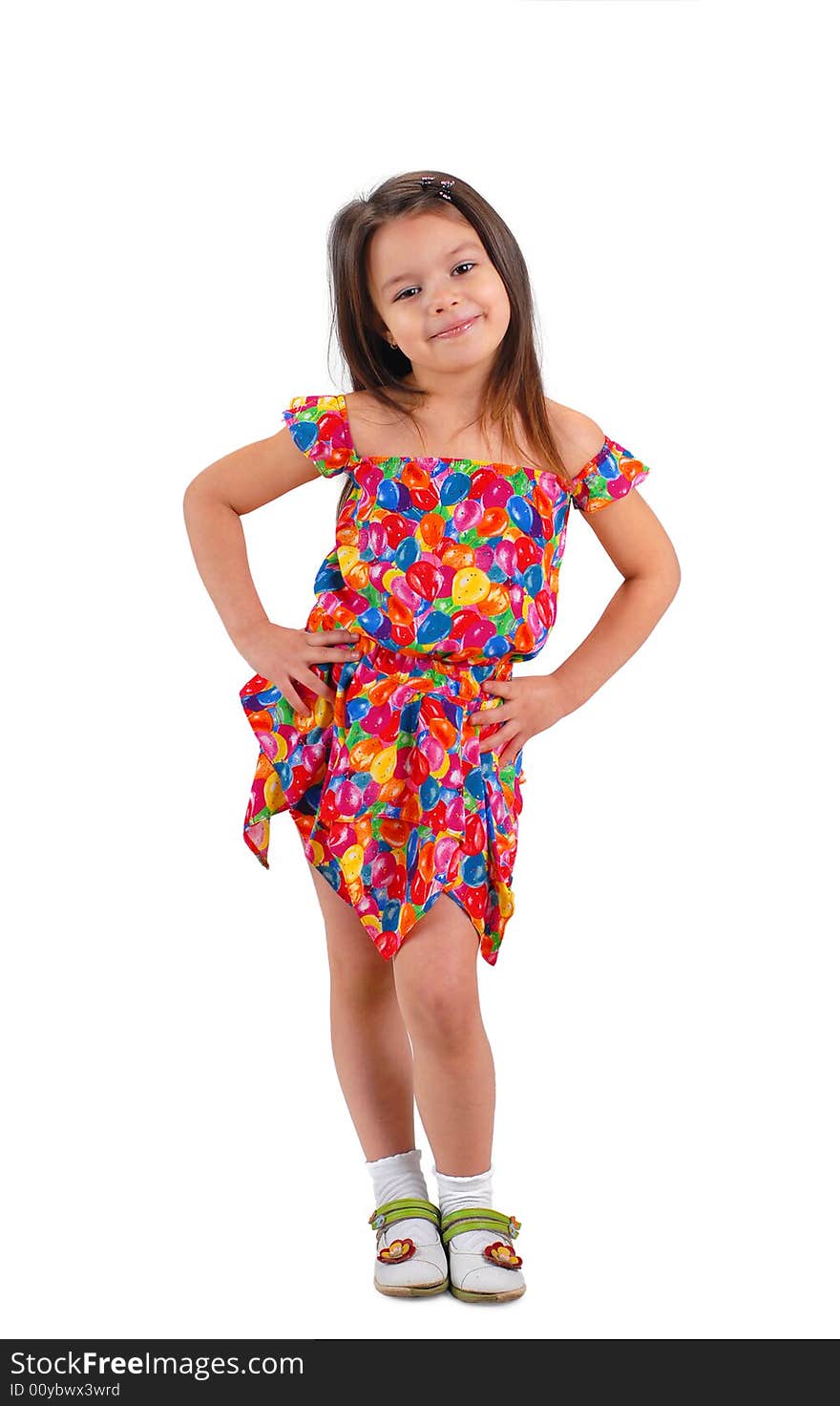 Little cute brown-haired baby girl posing in fancy-colored short dress. Little cute brown-haired baby girl posing in fancy-colored short dress