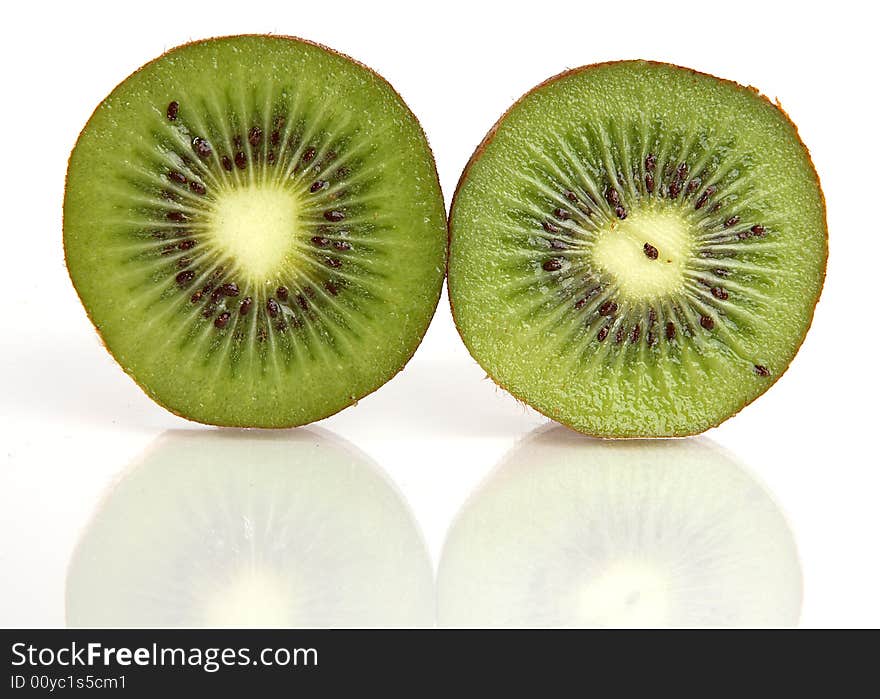 Kiwi cut in half with a reflection