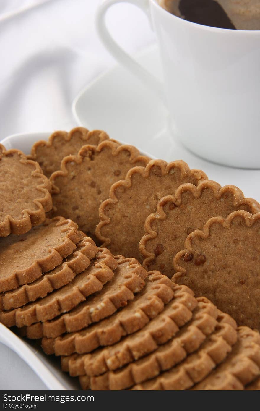 A cup of cafe and sweet cookies. A cup of cafe and sweet cookies