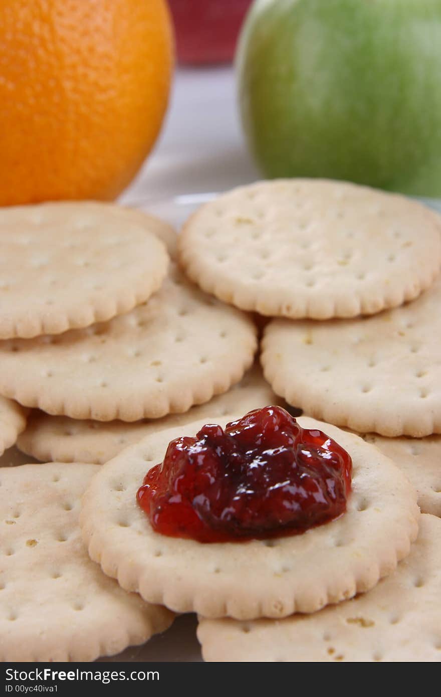 Round cakes with fruity jam on the plate