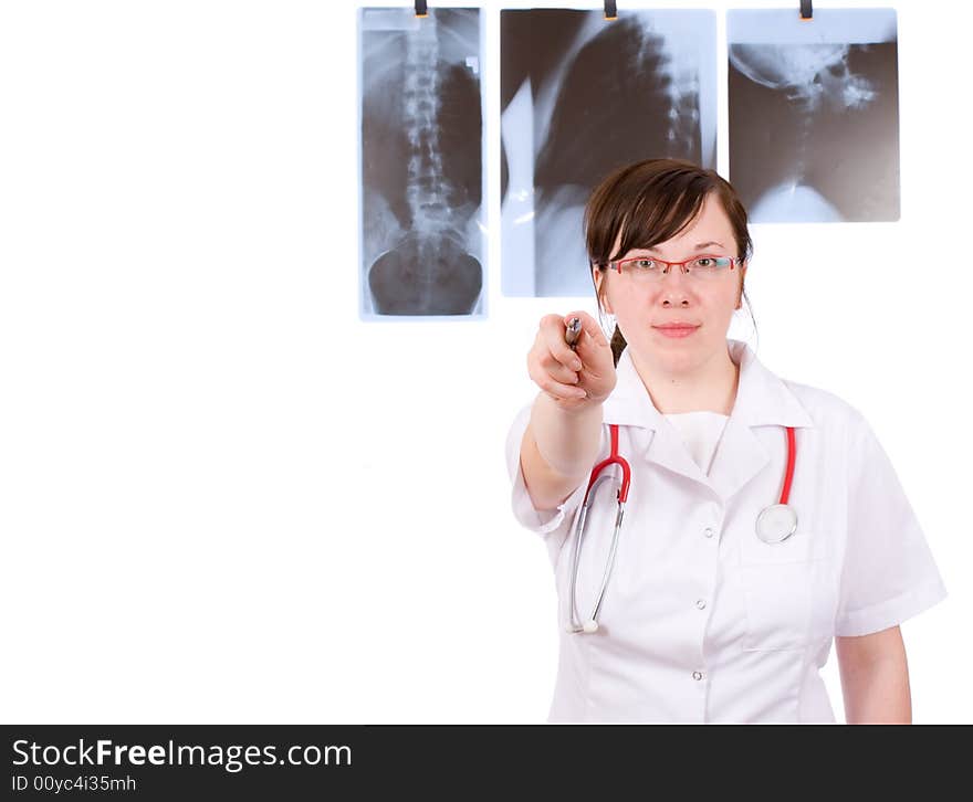 Young female doc pointing to camera, pen is in focus, while person is blurred, isolated on white. Young female doc pointing to camera, pen is in focus, while person is blurred, isolated on white