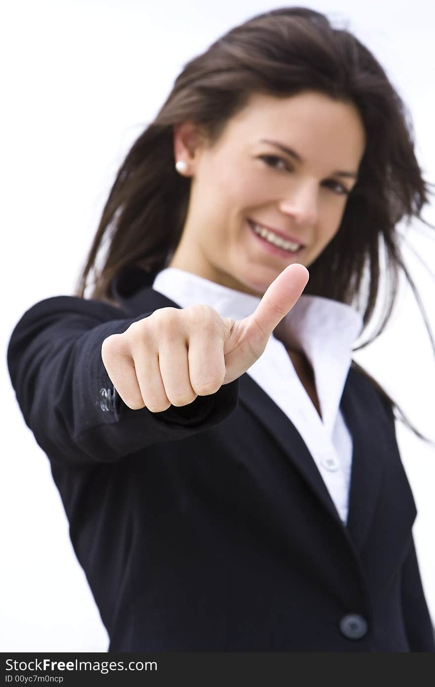 Succesful businesswoman, focus on thumb. Succesful businesswoman, focus on thumb