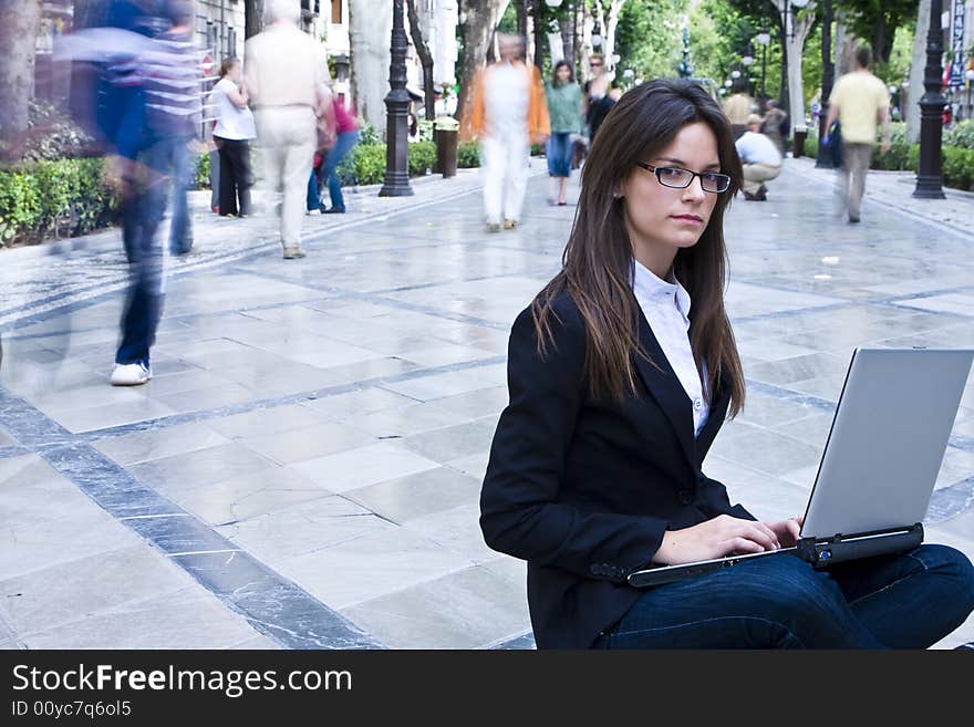 Young businesswoman  portrait under urban background. Young businesswoman  portrait under urban background