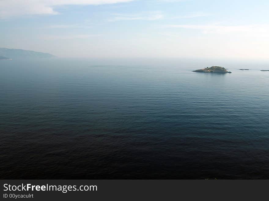 Landscape view of an island on a blue sea