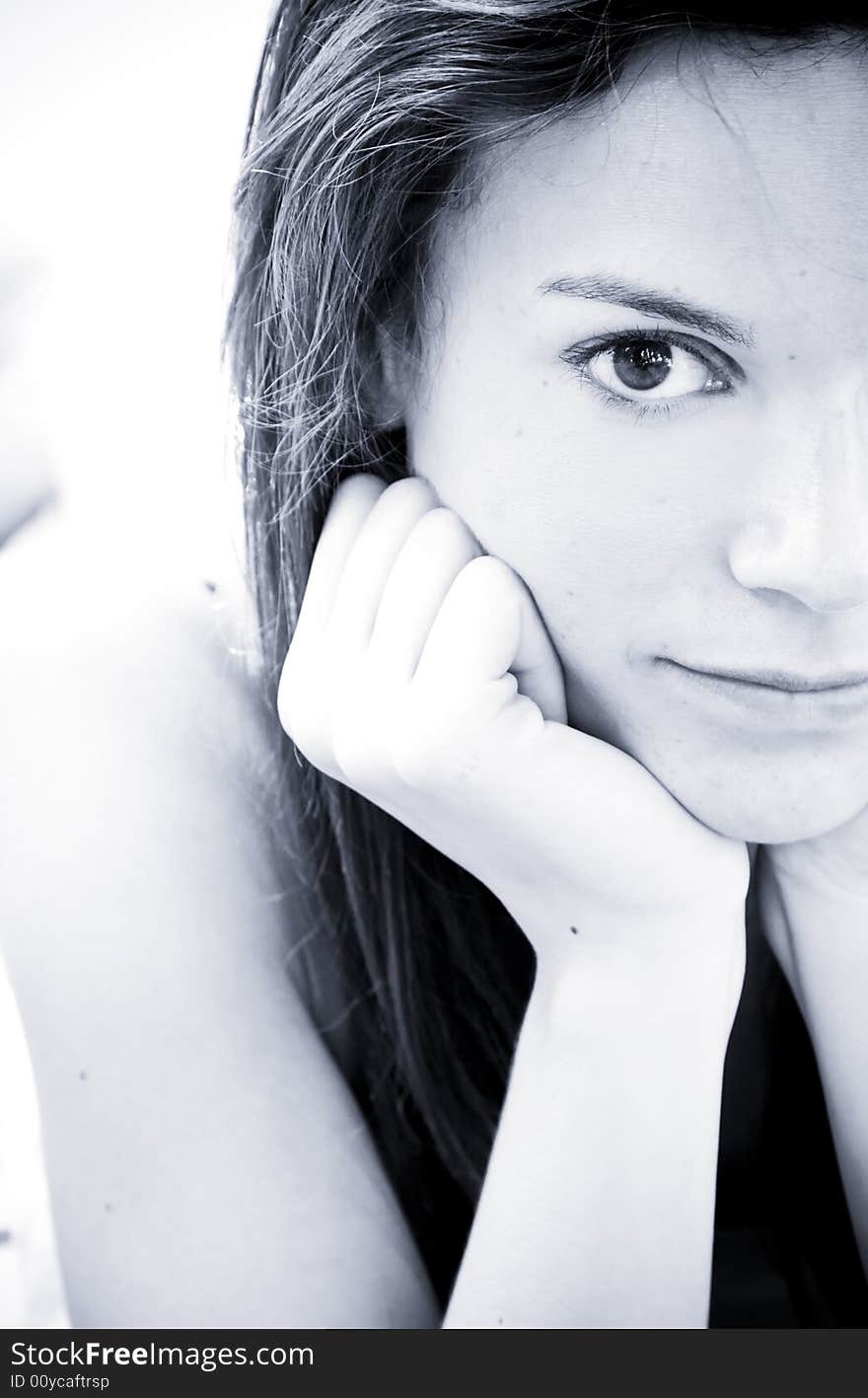 Young woman portrait, toned in blue.