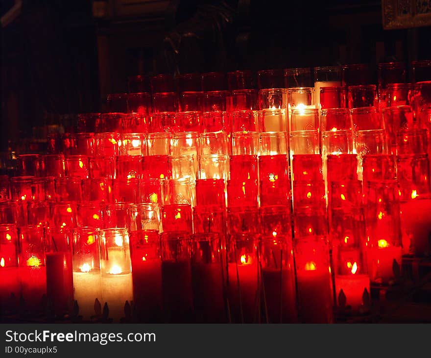 Glowing candles in a church. Glowing candles in a church