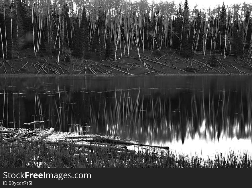 Glassy vacation lake in glorious untouched mountain range in winter. Glassy vacation lake in glorious untouched mountain range in winter