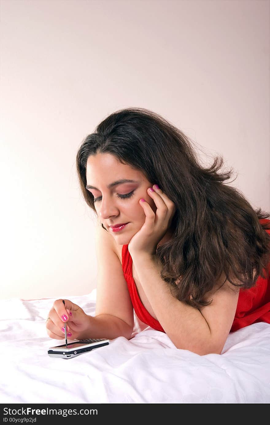 Girl in red dress Typing on her cellphone