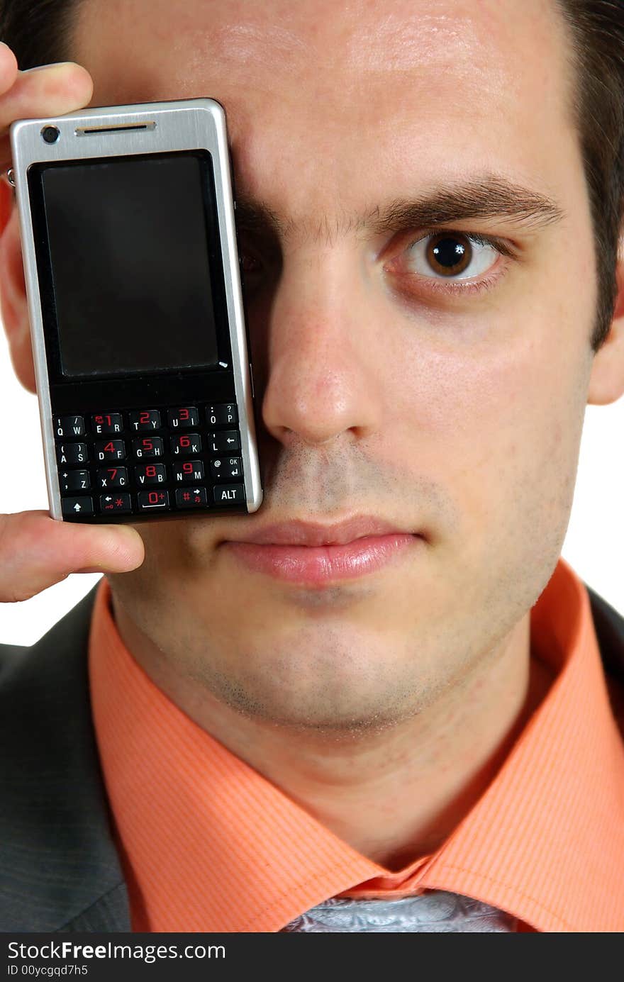 A man's portrait, with a cellphone in front of his eye. A man's portrait, with a cellphone in front of his eye