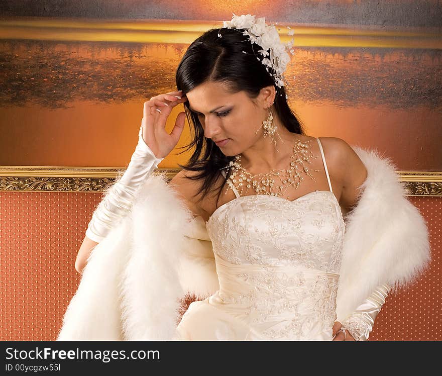 The bride in a wedding dress on beautiful background