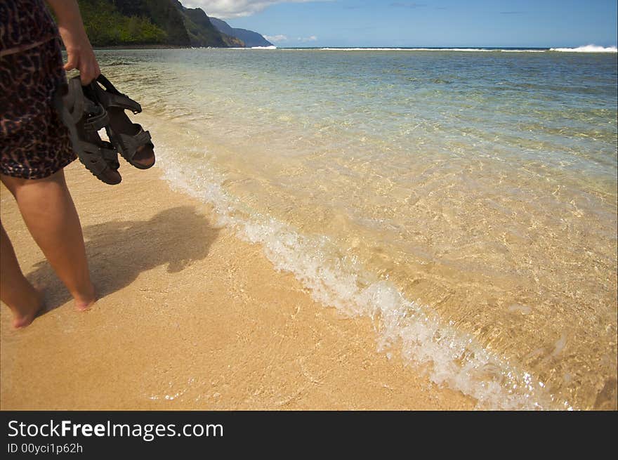 Woman Walks on the Na Pali Shoreline