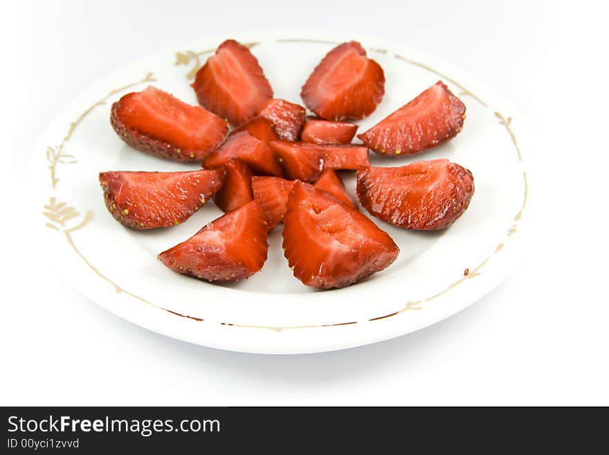 Sliced strawberries on plate