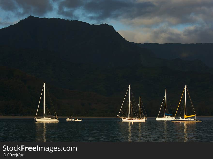 Sail boats in the Early Morning light on Hanalei Bay, Kauai, Hawaii.