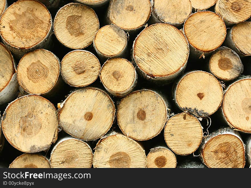 A background of a pile of wood. A background of a pile of wood