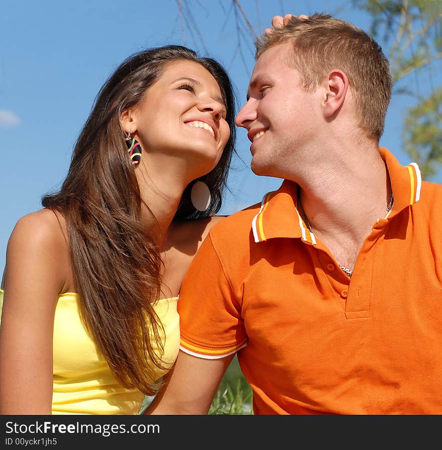 Portrait young beautiful girls and the guy on nature. Portrait young beautiful girls and the guy on nature