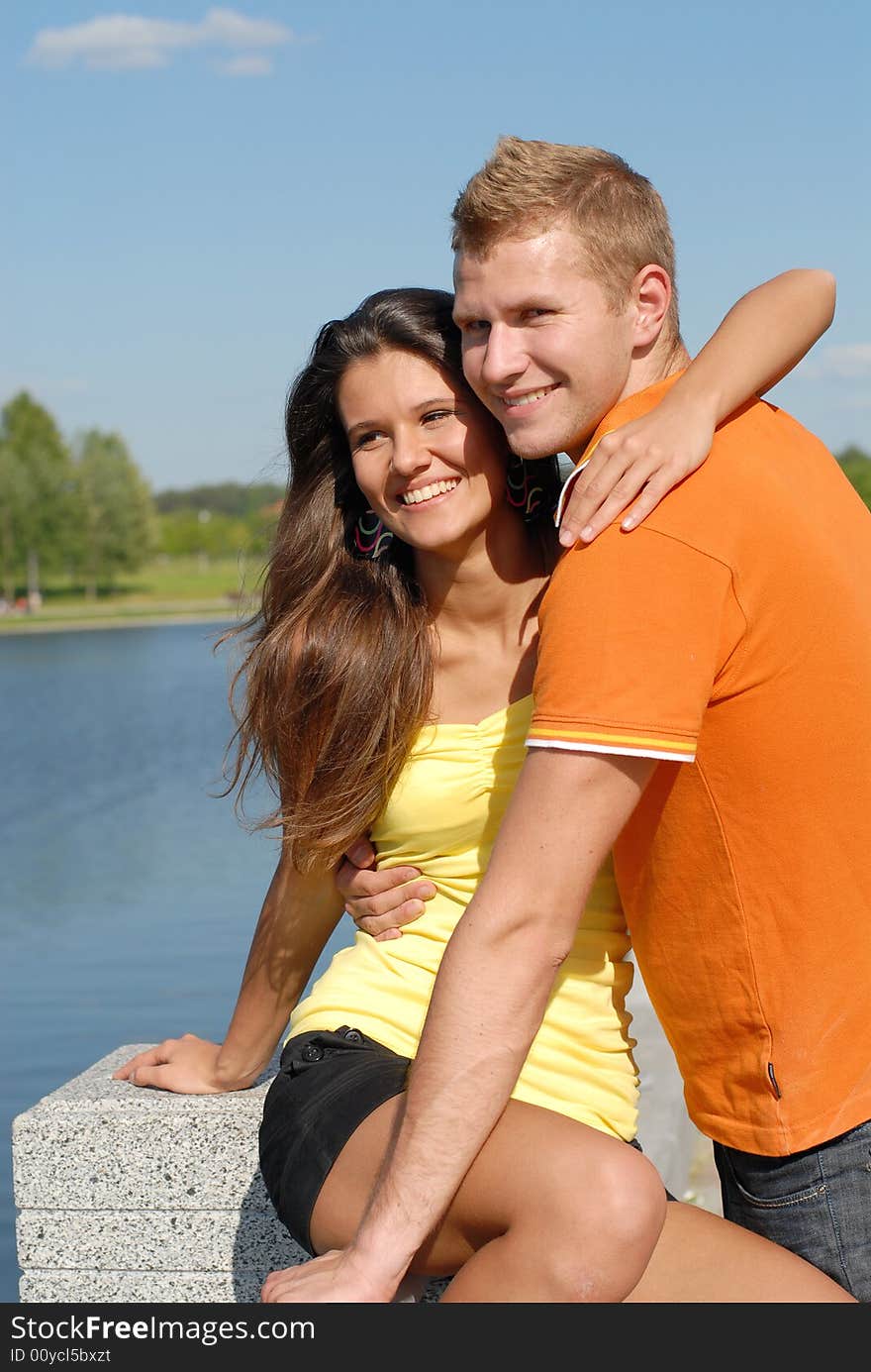 Portrait young beautiful girls and the guy on nature. Portrait young beautiful girls and the guy on nature