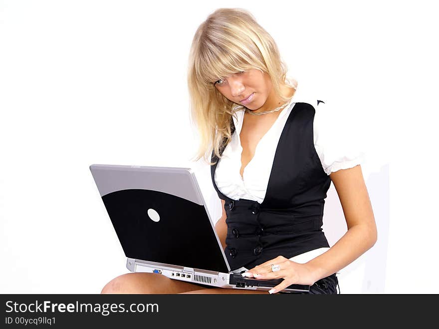 Young blond woman working on laptop white background. Young blond woman working on laptop white background.