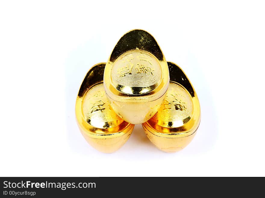 Decoration of chinese gold ingots in isolated white backgroun