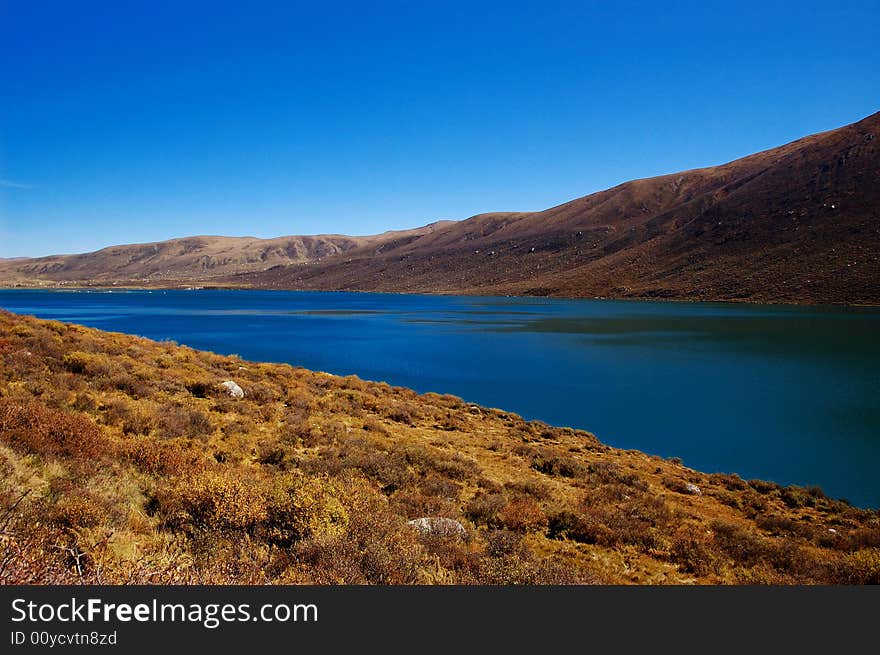 When travelling in Tibet of China, a  beautiful lake on field appears in front of us.