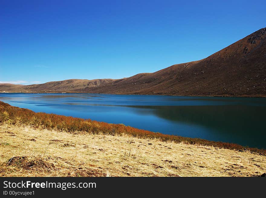 When travelling in Tibet of China, a  beautiful lake on field appears in front of us.