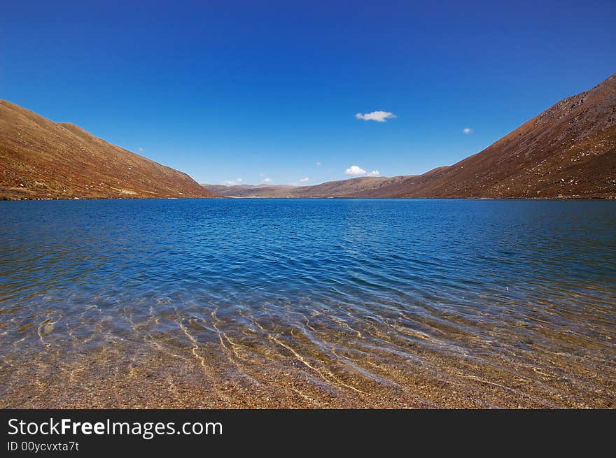 When travelling in Tibet of China, a  beautiful lake appears in front of us.