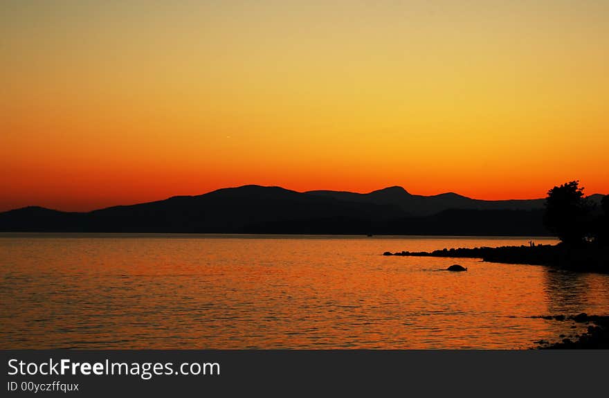 Silhouette of a mountain range in the sunset