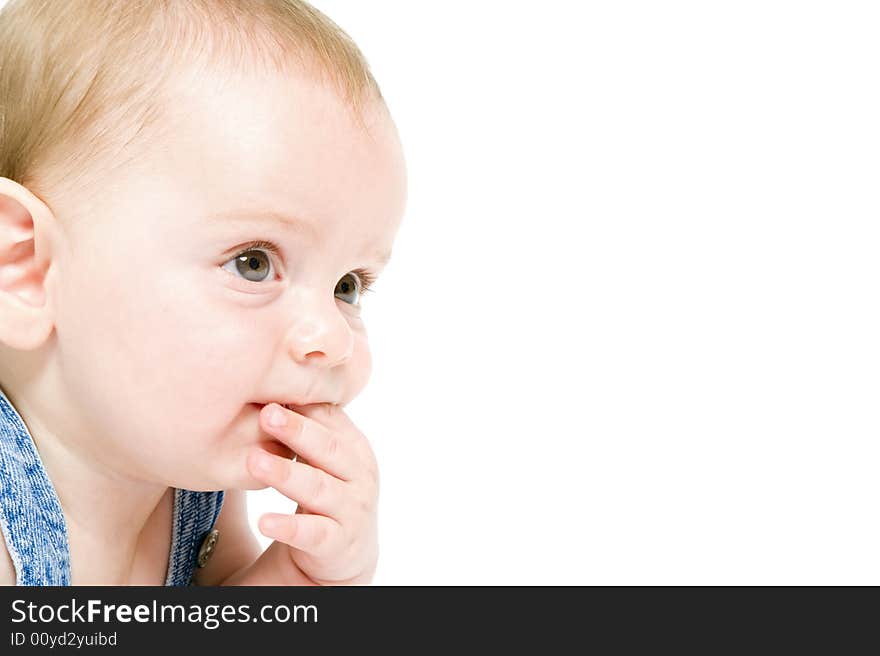 Six month old baby wearing jeans overall with the american flag isolated on white. Six month old baby wearing jeans overall with the american flag isolated on white