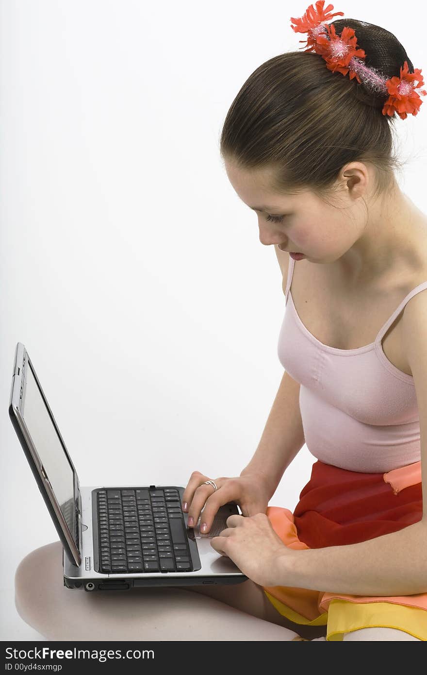 Teen girl sitting on a floor whith notebook computer. Teen girl sitting on a floor whith notebook computer