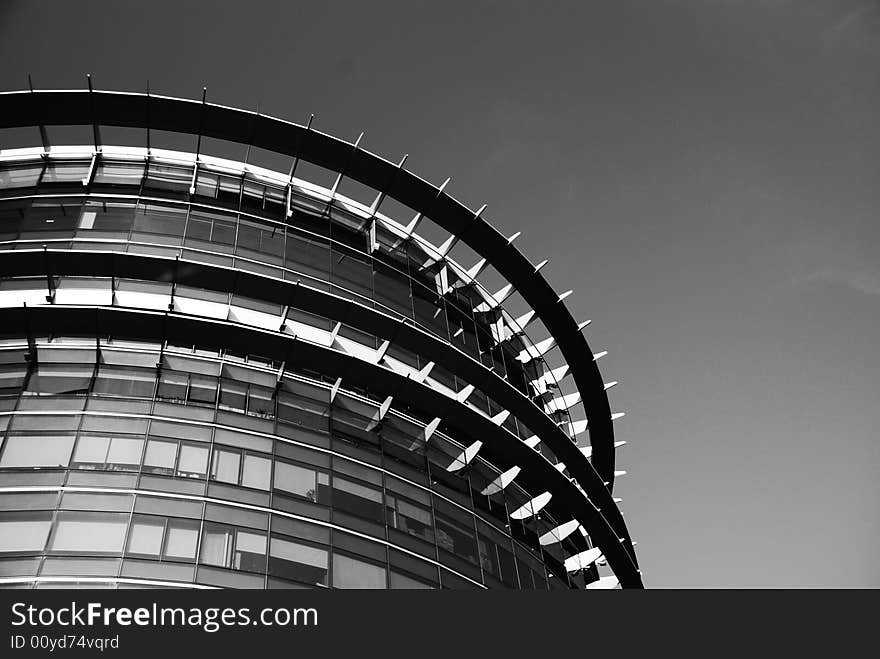 Picture of a glass and metal architecture. Suitable for architecture, construction or modern city context.