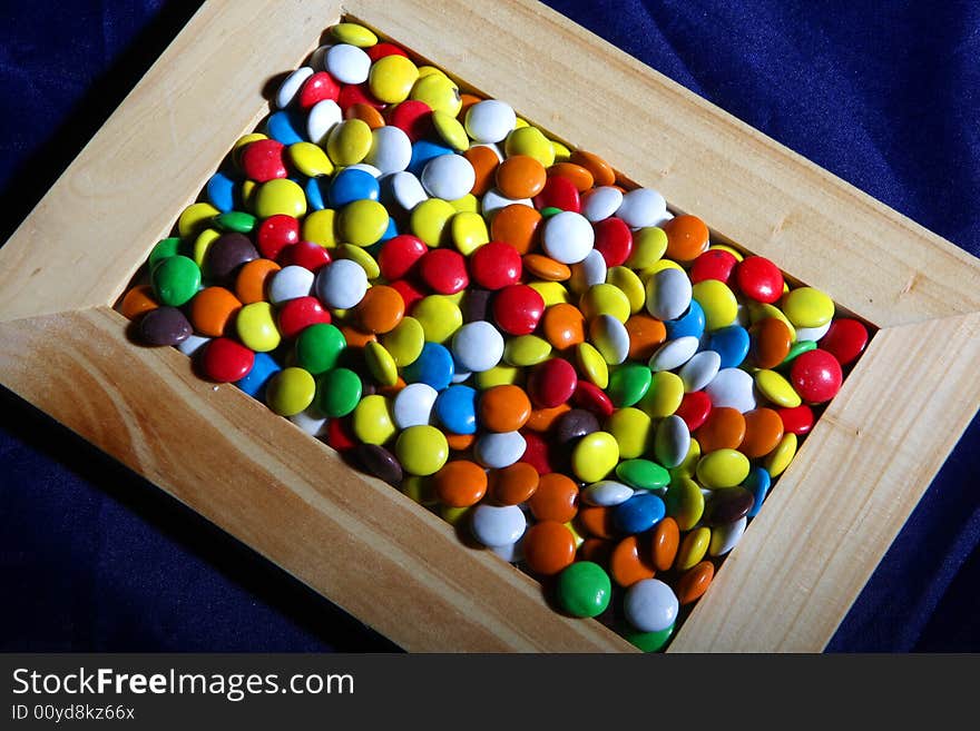 Many colored candies and a frame