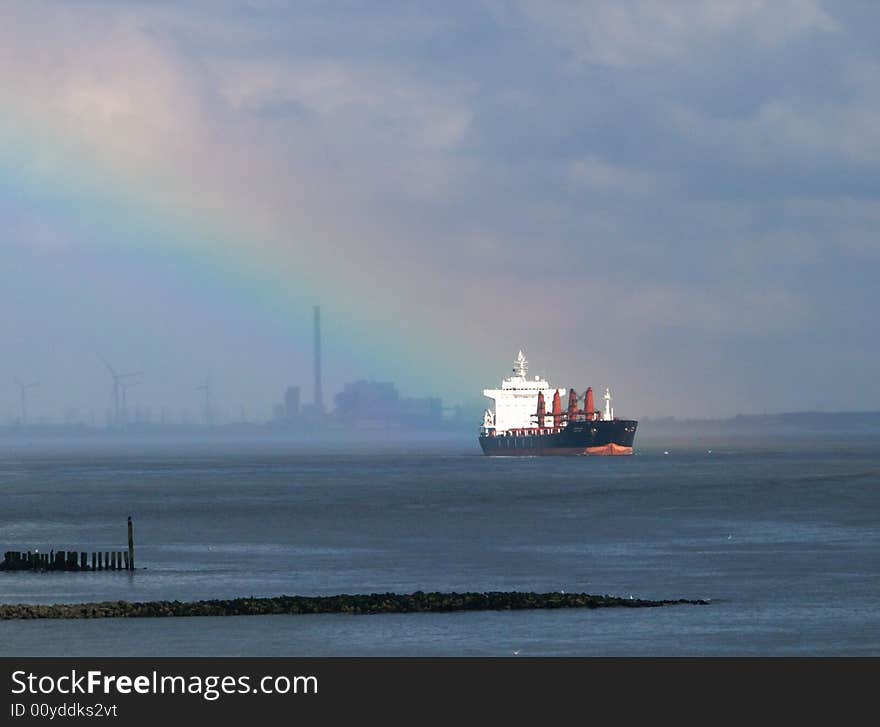 Rainbow lights up a ship