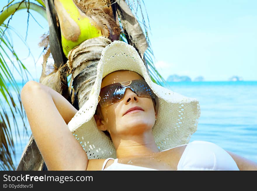 View of nice woman having fun on tropical beach. View of nice woman having fun on tropical beach