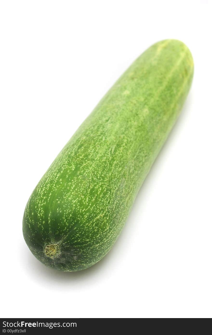 Close up of a cucumber over white background.